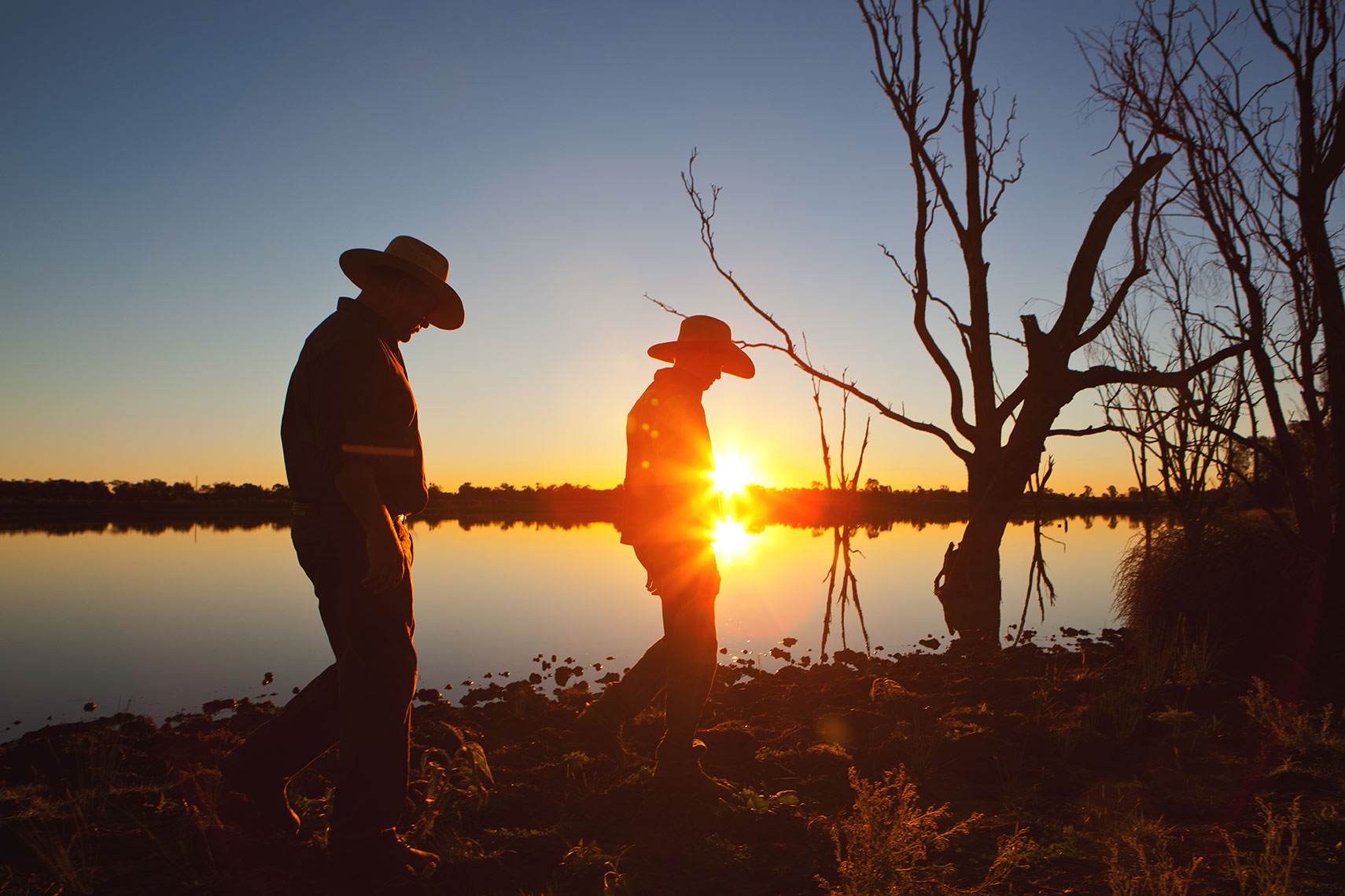 Farmer and son on property in Australian outback